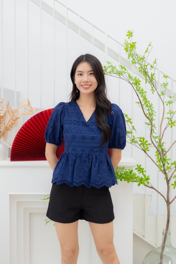 Mel Eyelet Peplum Top In Navy